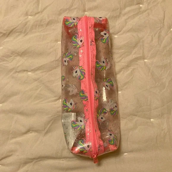 A pink, white, clear unicorn pouch. From: H&M. Name: Unicorn Pouch - Picture 3 of 5